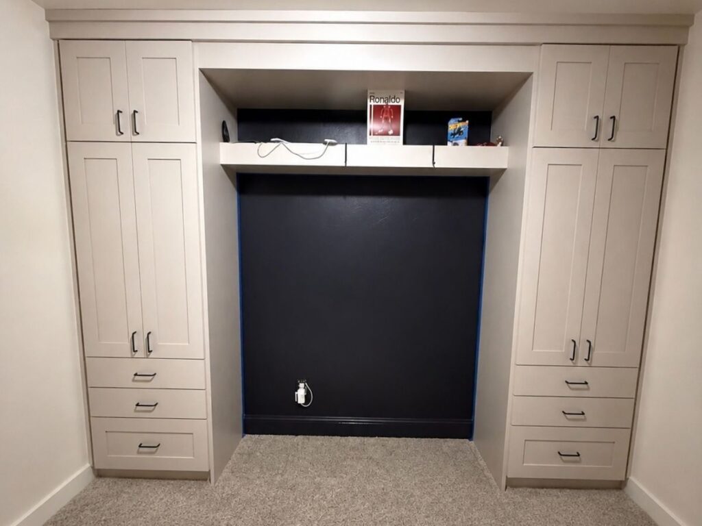 Cream built-in custom cabinetry with drawer stacks framing a center niche